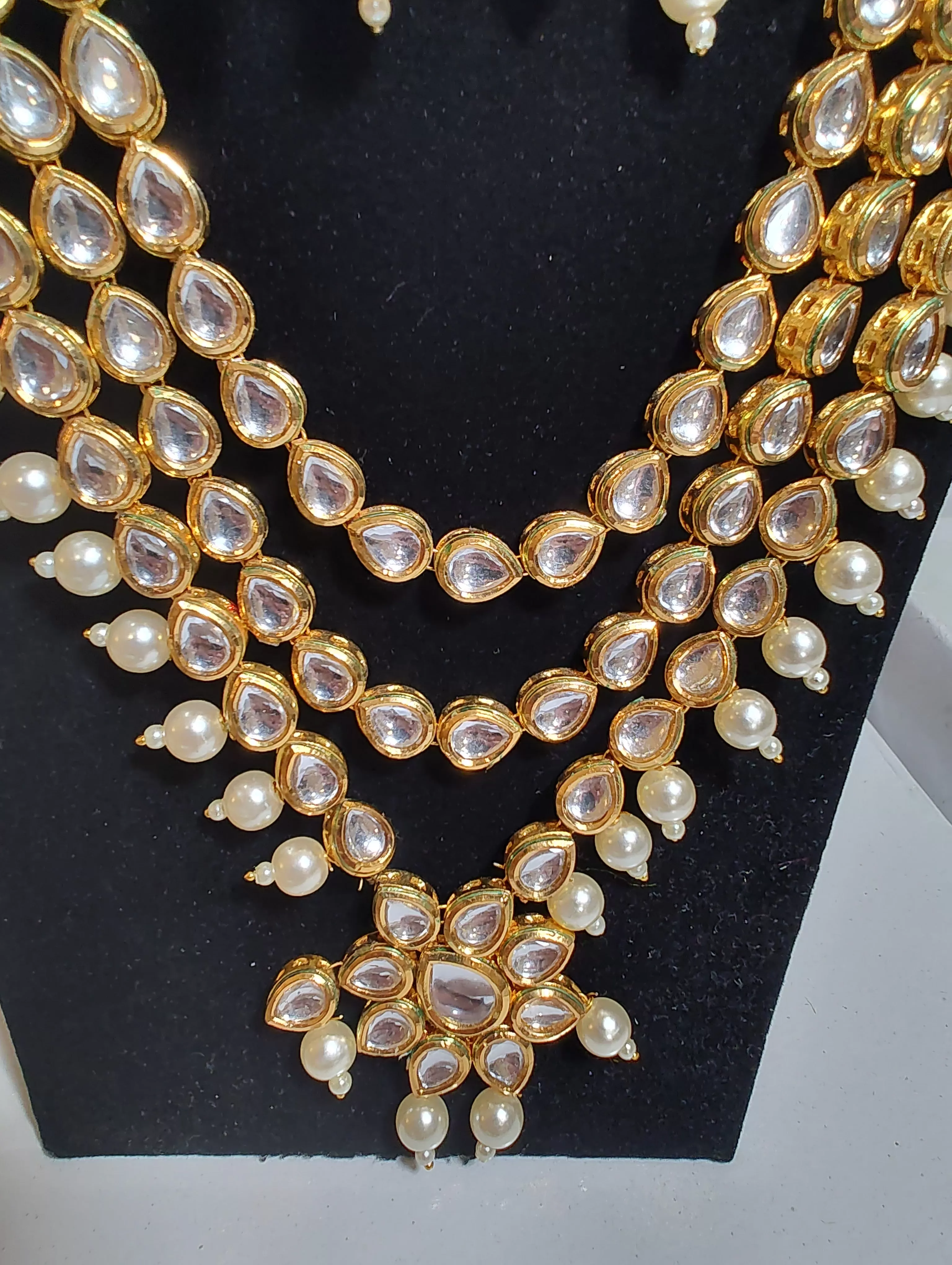 Attractive Three Layer Kundhan Necklace With Pearls And Chain Hanging